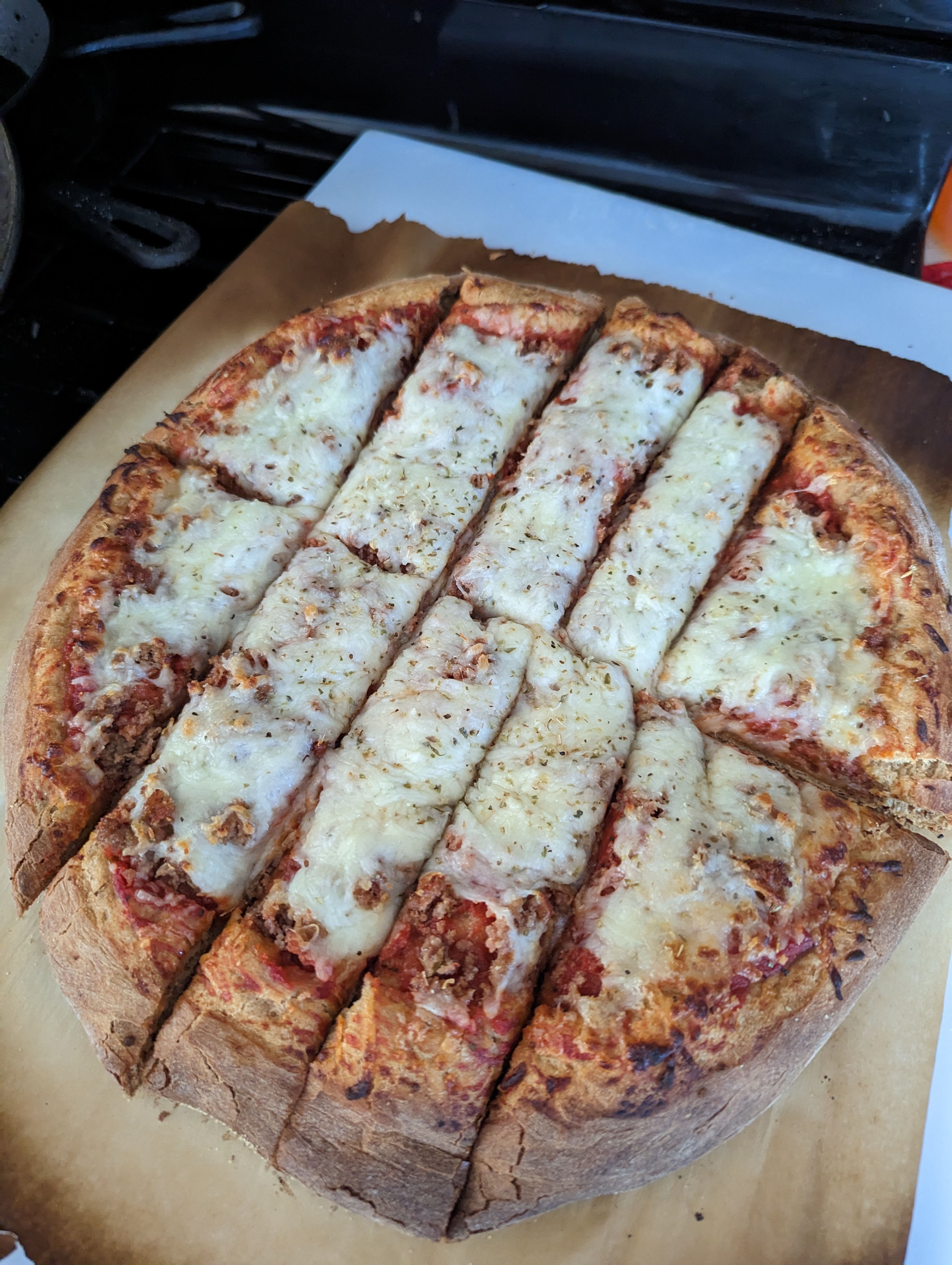 15 inch Quad Cities sausage pizza cut in strips